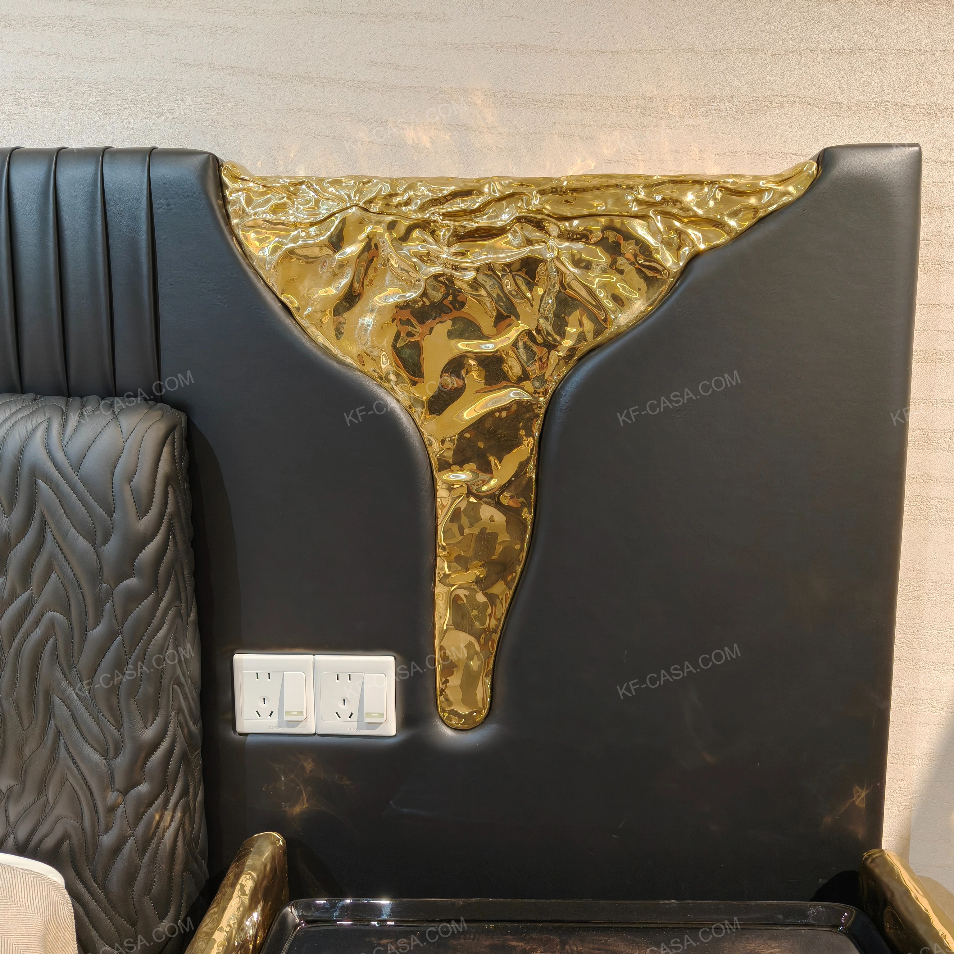 Black Leather Upholstered Bed with Textured Gold Accents, Patterned Quilted Detailing & Brass Hardware Feet